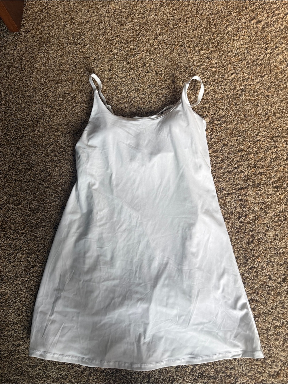 White athletic dress with built in shorts, built in bra and adjustable straps.